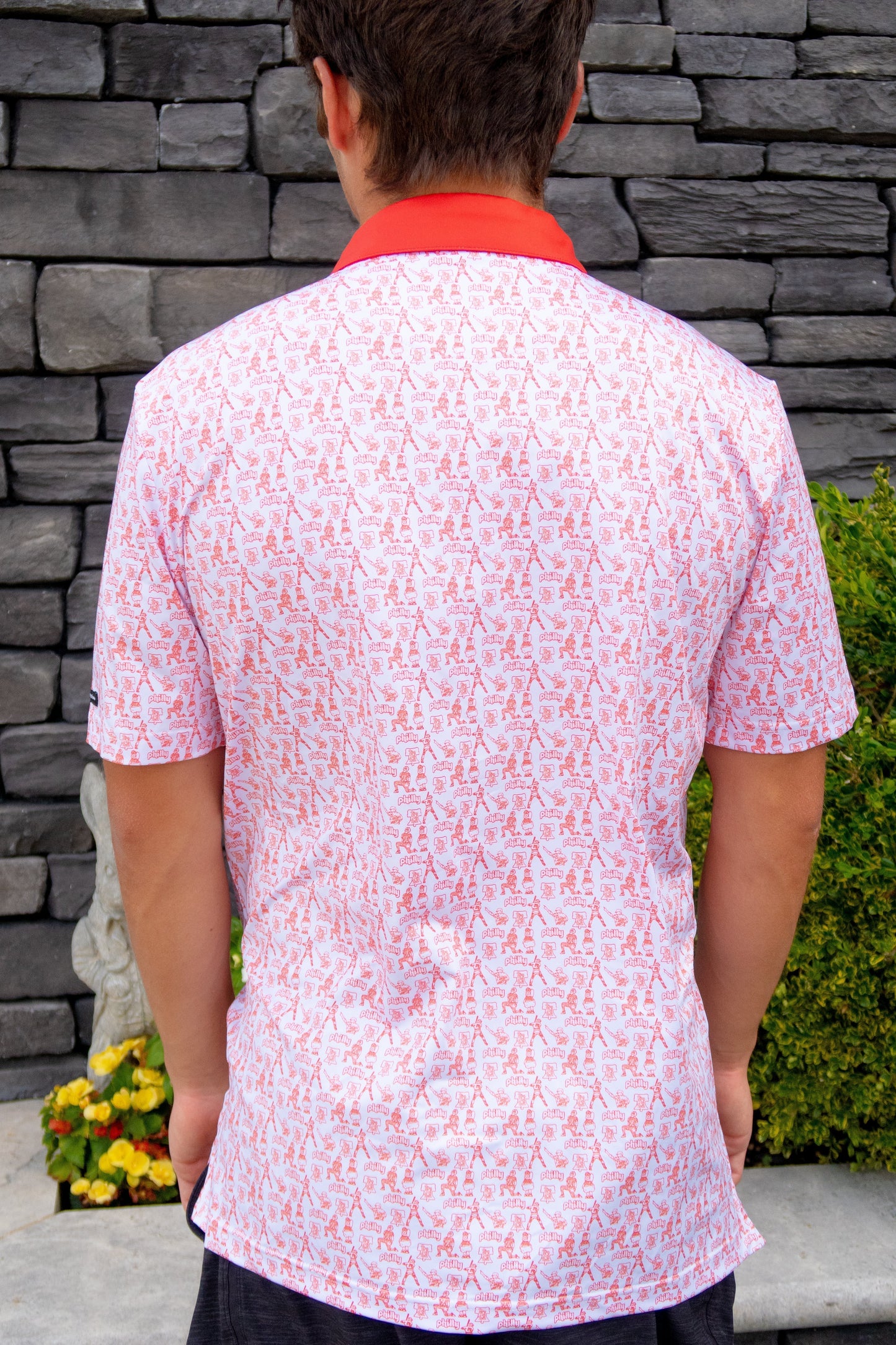 Back view of The South Philly Sandlot golf polo showing athletic cut and Philadelphia baseball-inspired red and white design