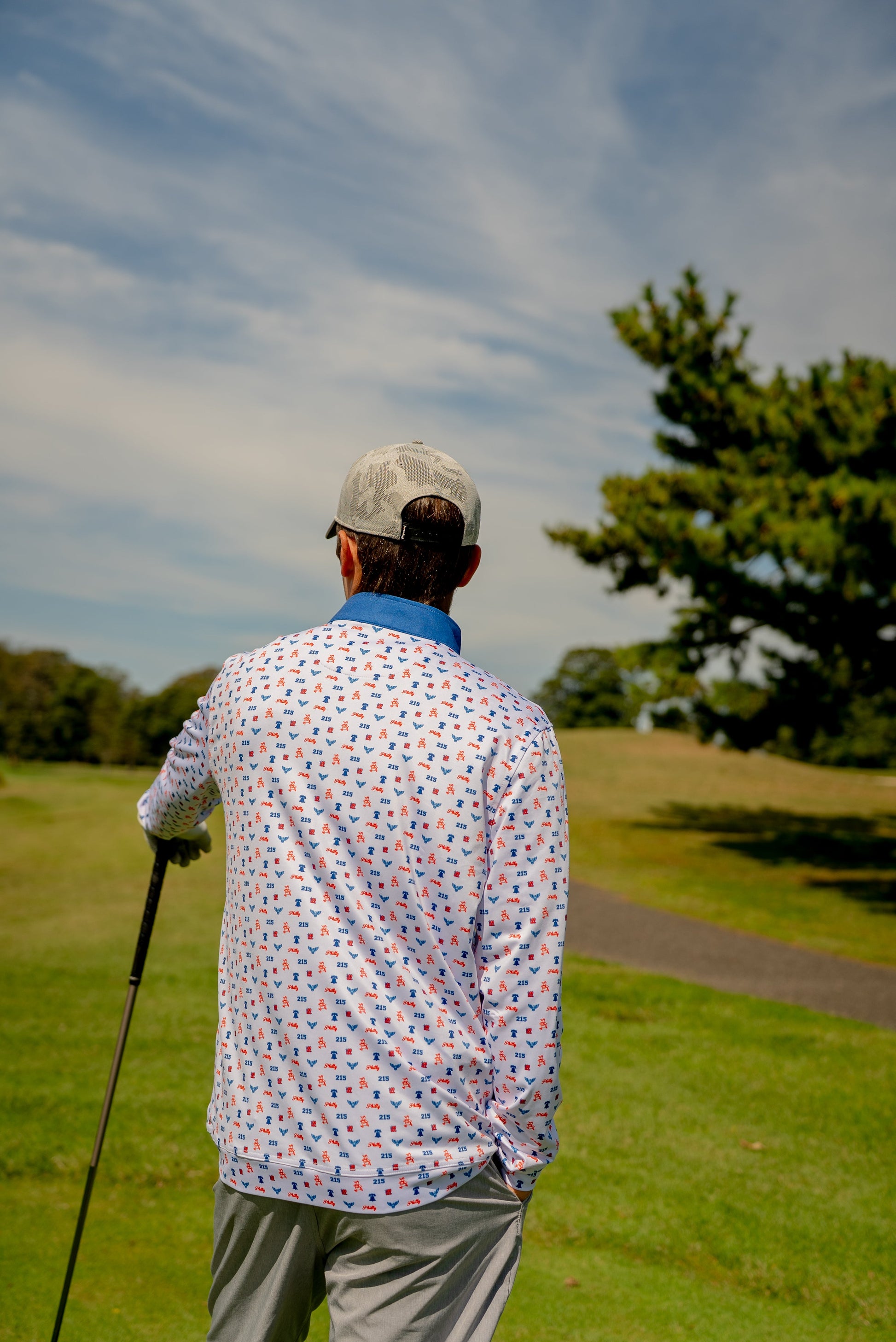 Back view of The Phrenetic Zip quarter zip pullover showcasing shoulder detail and breathable fabric made for movement on and off the course.