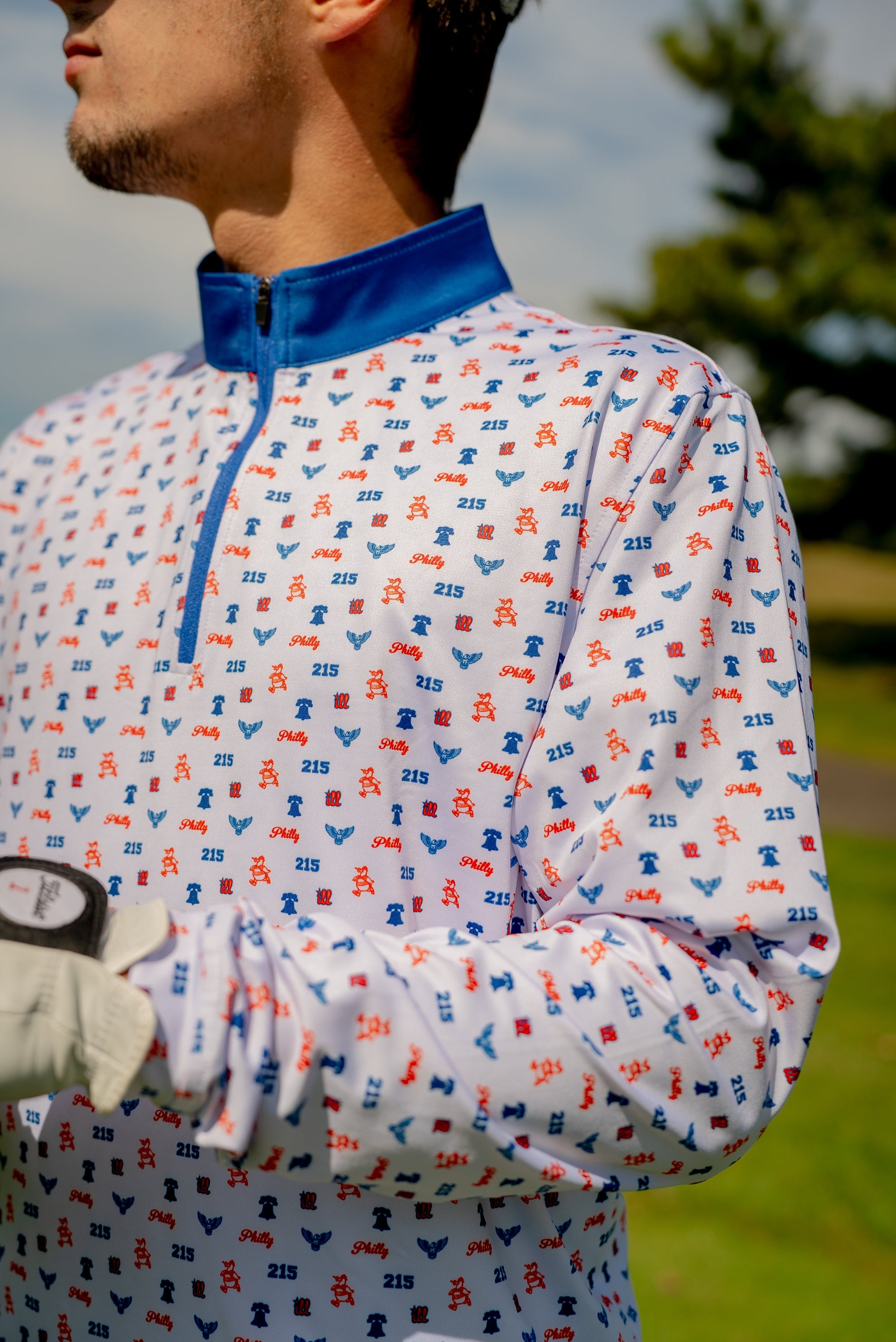 Alternate front angle of The Phrenetic Zip showing athletic fit, contrast zipper, and Philly flair—built for golf, chaos, and comfort.