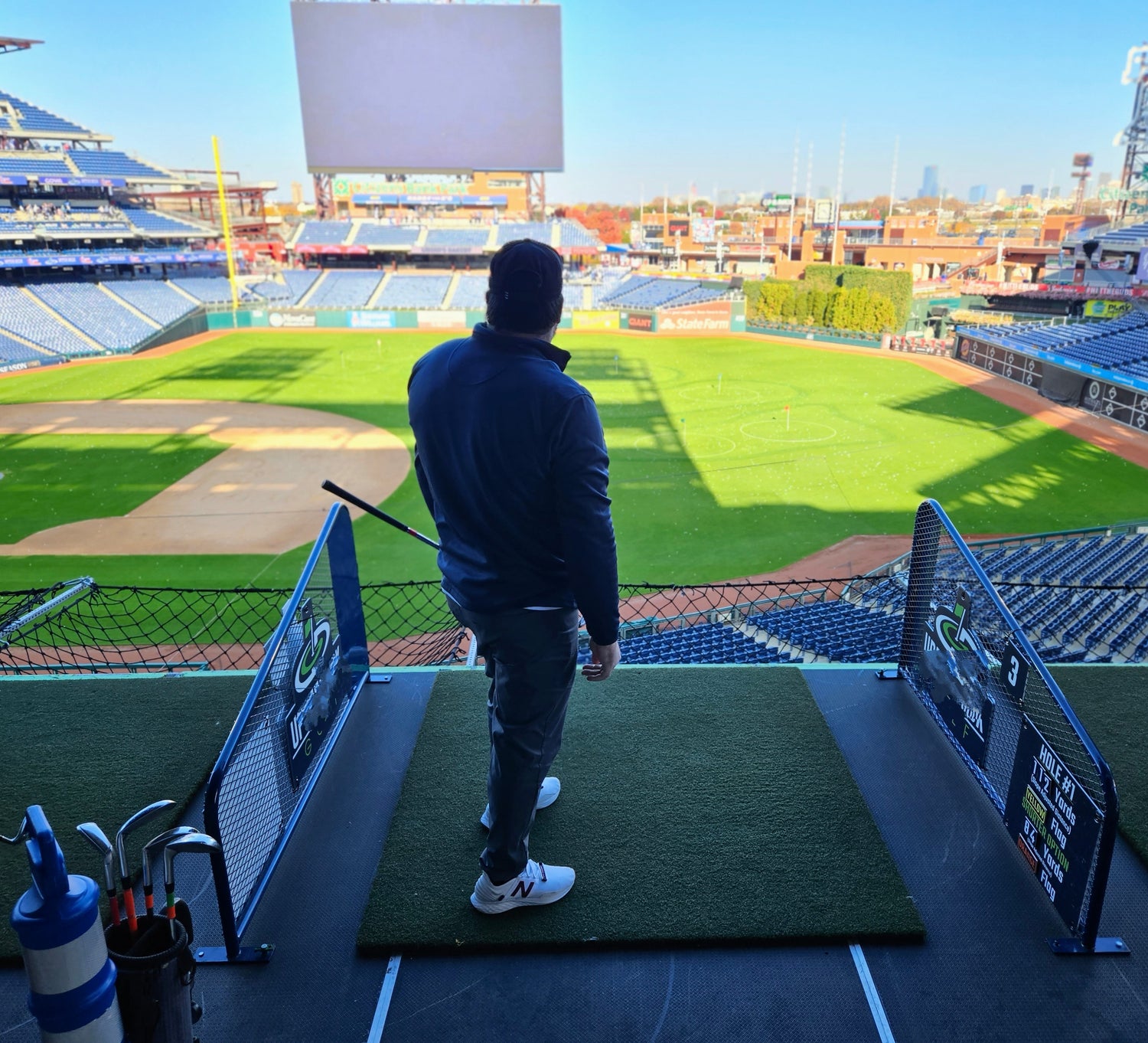 Man Playing Golf In Baseball Stadium